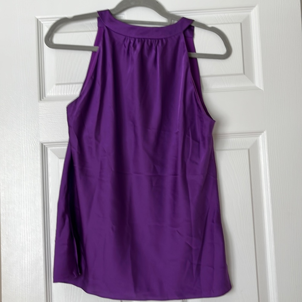 Never worn but  without tags sleeveless elegant blouse
